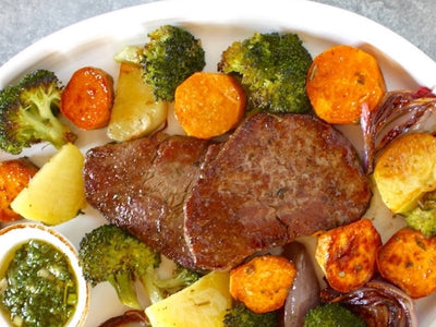 Pan-Seared Beef Medallions with Roasted Veggies + Fresh Herb Sauce