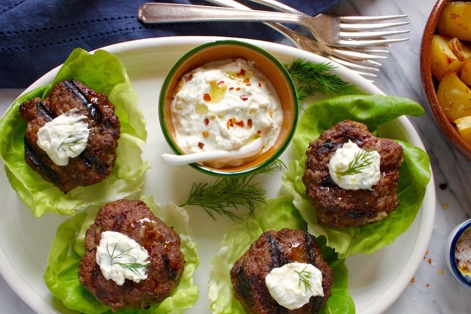 Lettuce-wrapped Lamb Sliders with Greek Feta + Yogurt Sauce